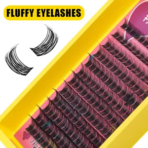 Macro detail of dense black fluffy eyelash clusters in a yellow and purple tray