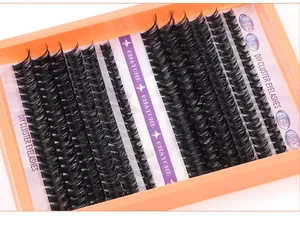 Macro shot of 240 fluffy dense DIY cluster lashes in a vibrant orange tray packaging