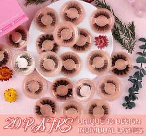 Detail of 20 pairs 3D cross false eyelashes in pink glitter trays with macro texture