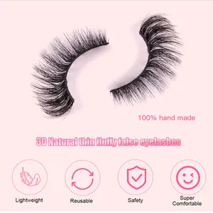 Macro detail of handmade 3D natural fluffy false eyelashes on pink background