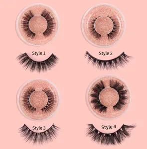 Detailed view of four false eyelash styles in clear boxes with pink glitter base