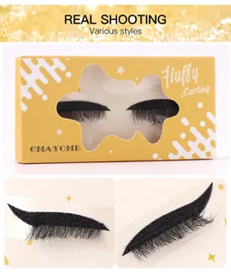Macro detail of fluffy curling black false eyelashes with adhesive base in yellow packaging