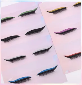 Detail view of 7-color glitter eyeliner and false eyelash set on a soft pink background