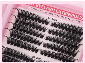 Close-up of 60 PRO and 80 PRO DIY cluster lashes in a soft pink packaging box