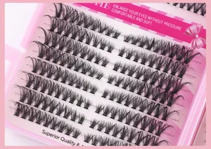 Detailed close-up of individual cluster lashes in pink packaging with 3D volume effect