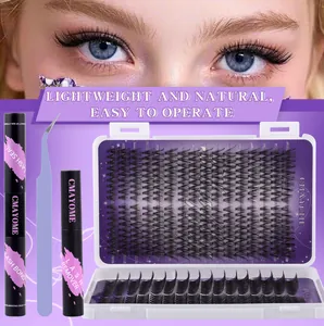 Macro shot of eyelash extension kit including clusters, bond and seal, remover, and tweezers