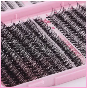 Macro view of individual black eyelash clusters in high density with a curled texture