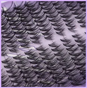 Close-up of dense black synthetic fiber false eyelashes in multi-layered volume design