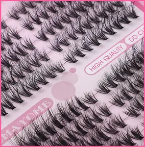 Macro shot of high quality DD curl cluster eyelash extensions on a pink card