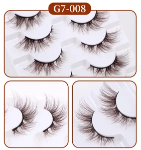 Detailed macro view of 7 pairs of thick dark brown fluffy false eyelashes in tray