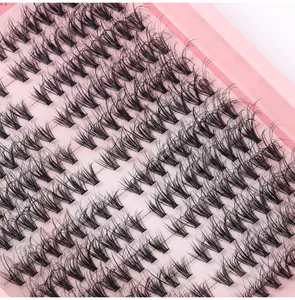Macro shot of thick segmented cluster eyelashes with a dense curly effect on pink tray