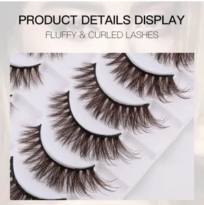 Detail view of fluffy and curled deep brown false eyelashes displayed in a five-pair pack