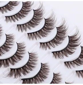Macro detail of 10 pairs of 3D layered brown false eyelashes in a white storage tray