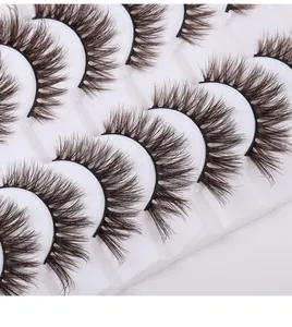 Macro shot of 10 pairs of dense brown 3D eyelashes in a professional tray