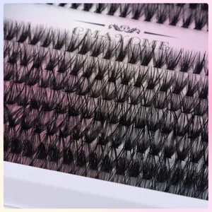 Macro detail of thick DIY individual lash clusters with CMAYOME branding on pink backing