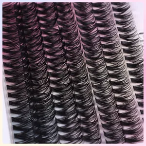 Macro detail of curly black DIY individual eyelashes with tight synthetic fiber clusters