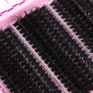 Detailed close-up of natural dense individual lash clusters in a pink storage tray