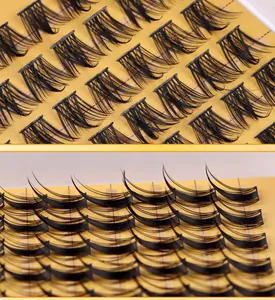 Macro view of individual black cluster eyelashes with natural curl on a textured base