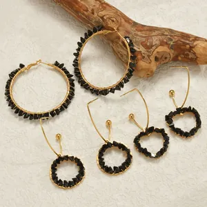 Golden heart and hoop earrings set with black crystals and bohemian wire wrapped details