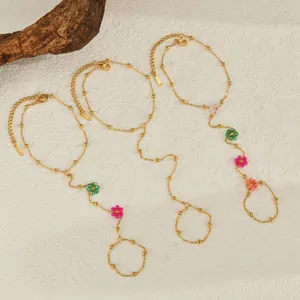 Golden stainless steel hand chain with colorful beaded flowers in Bohemian style
