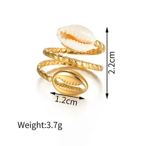 Verstelbare gouden schelpring met gedraaide band en parelmoer details