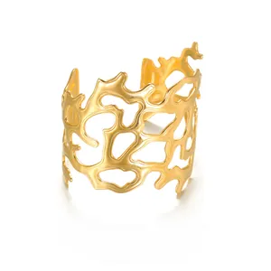 Artistic gold-plated stainless steel hollow cuff bracelet with irregular cut-out pattern