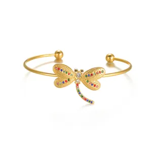 Bracelet jonc libellule doré avec cristaux colorés et finition polie brillante