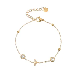 Detail of 18K gold-plated stainless steel bracelet with zircon fish tail pendant and clasp