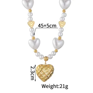 Detailed view of pearl heart necklace with hollow gold pendant and 45cm chain length