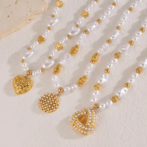 Three elegant 18k gold butterfly sweater chains with pearls and heart pendants