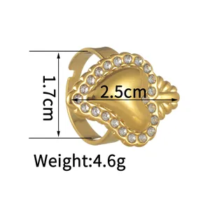 Polished gold heart ring with pavé rhinestones on an adjustable open stainless steel band