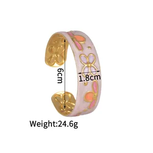 Detail view of vintage enamel flower bangle showing dimensions 6cm diameter and 1.8cm width