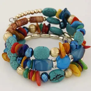 Detailed close-up of bohemian wrap bracelet with turquoise beads and colorful stone layers