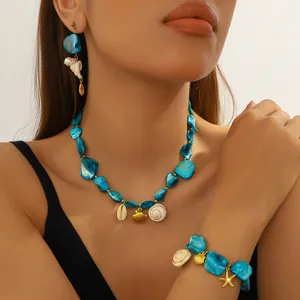 Σετ boho κοσμημάτων με τυρκουάζ χάντρες, χρυσά κοχύλια, αστερία και αληθινά κοχύλια