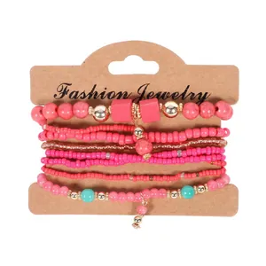 Bohemian multi-layer handmade beaded bracelet set with pink beads and golden accents