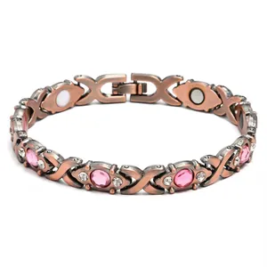 Detail of copper magnetic therapy bracelet with pink stones and magnetic inserts
