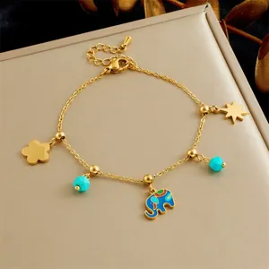 Bracelet à breloque éléphant plaqué or avec pendentif bleu et étoile octogonale
