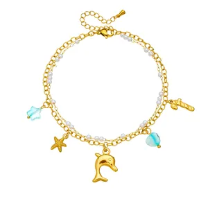 Gold double-layered anklet with shell, dolphin, and starfish pendants for ocean style