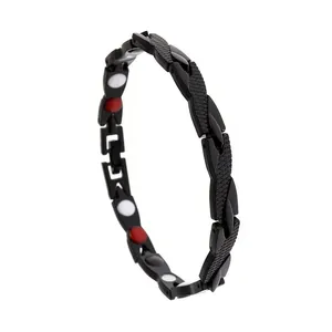 Detail of matte black dragon link bracelet with red and white magnetic inserts