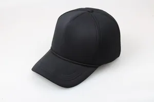 Detail view of a black foam trucker hat with high crown structure and braided visor rope