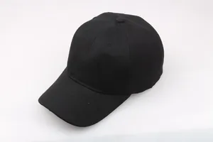 Detailed view of black twill cotton baseball cap showing six-panel stitch and curved brim