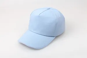Detail view of reinforced stitching on the brim of a light blue cotton baseball cap