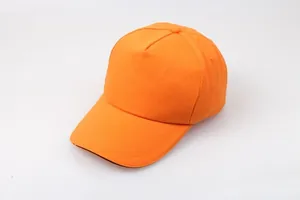Detail view of bright orange cotton baseball cap with reinforced stitching on the curved brim