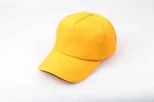 Detail view of the yellow cotton baseball cap showing black brim edging and twill texture