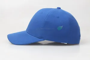 Side view detail of a classic blue baseball cap with a structured six-panel design