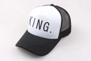 Detail of black and white trucker hat with KING lettering and breathable mesh back
