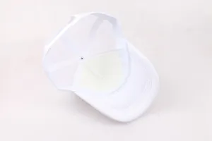 Internal detail of white trucker hat showing breathable mesh and structural tape