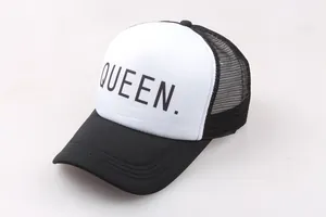 Detail of black and white trucker hat with QUEEN lettering and breathable mesh back
