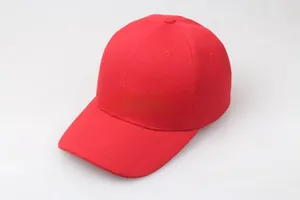 Detail view of red baseball cap with reinforced stitching and cotton twill texture