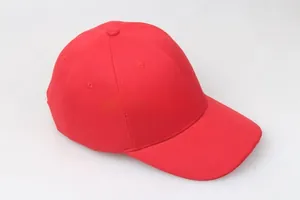 Detail view of red baseball cap featuring twill cotton fabric and embroidered eyelets